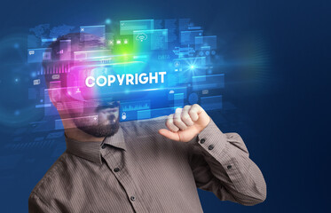 Businessman looking through Virtual Reality glasses