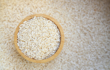 Top view of raw sticky rice in bowl for measure in cooking