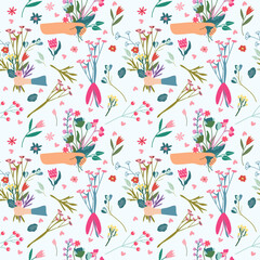 Seamless pattern with a hand giving a bouquet of wild flowers, berries, leaves, hearts around. Floral pattern can be used as textile, fabric, wallpaper, banner, etc. Vector