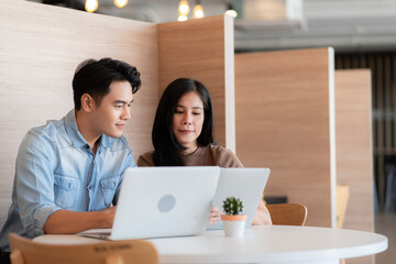 Young students researching inventions with modern technology in university libraries.