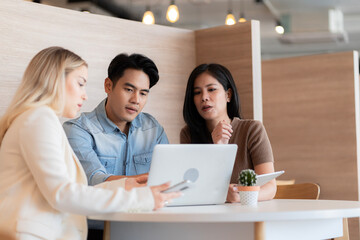 Young students researching inventions with modern technology in university libraries.