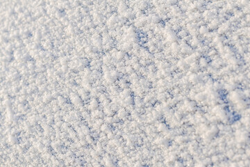 Obraz premium Window covered with snow,selective focus,copy space.Fractional snow texture,frozen precipitation.