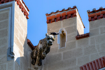Crow on statue of dog on castle Hluboka