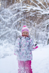little girl playing in snow