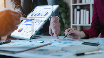 Team of businesspeople working with chart of accounts (COA) and balance sheet, stock market data,...