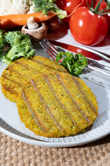 Grilled tasty vegan and vegetarian burgers made from fresh broccoli vegetables and dried legumes and beans