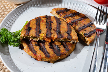 Barbecue grilled tasty vegan and vegetarian burgers made from fresh vegetables and dried legumes and beans
