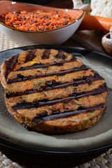 Barbecue grilled tasty vegan and vegetarian burgers made from fresh vegetables and dried legumes and beans