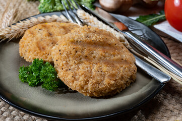 Source of fibre plant based vegan wheat protein grilled burgers, meat free healthy food close up