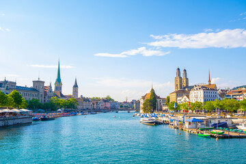 Scenic panoramic view of historic Zürich city center with famous Fraumünster and Grossmünster Church and river Limmat at Lake Zurich on a beautiful sunny day with blue sky in summer, Switzerland