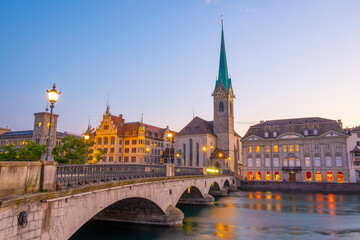 Scenic panoramic view of historic Zürich city center with famous Fraumünster and Grossmünster Church and river Limmat at Lake Zurich on a beautiful sunny day with blue sky in summer, Switzerland - obrazy, fototapety, plakaty