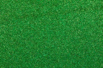 shimmering GREEN glitter material background with sparkles ideal as a lawn backdrop