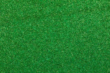 Fototapeta premium shimmering GREEN glitter material background with sparkles ideal as a lawn backdrop