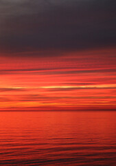 Photo of a bright red sunset on the Black Sea