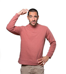 Concerned young man doing a gesture of confusion