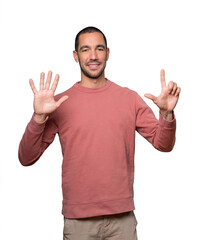 Happy young man doing a number seven gesture with his hands