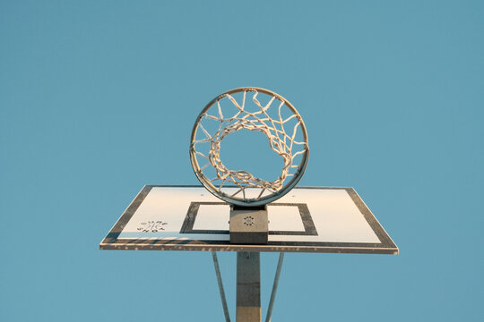 Basketball hoop with net on sports ground