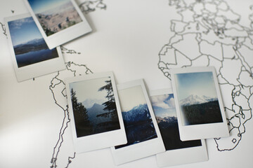 Polaroid Photos Layout of Mountains on Travel World Map