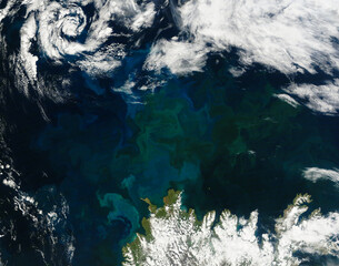 Aerial colorful sea background. Turquoise sea view. Abstract colorful shapes. Elements of this image furnished by NASA.
