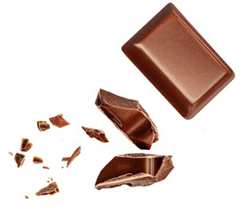 Dark chocolate chunks isolated on white background. Collection. Flying Chocolate pieces, shavings...
