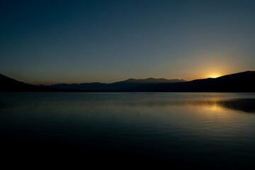 Fototapeta na wymiar Quiet Sunrise over Isolated Lake