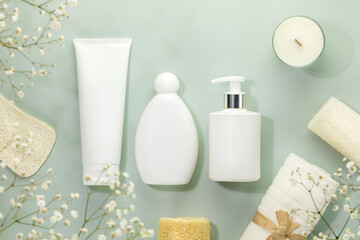 Eco friendly spa relax composition with mockup of beauty products, candle and spa accessories on blue background with white flowers. Wellness and skin care treatment. Concept of me time and self care