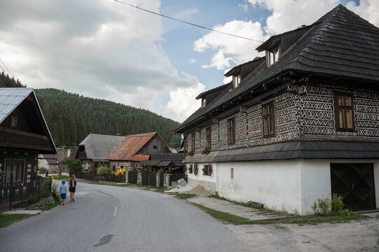 Street and old wooden buildings in Cicmany , Slovakia