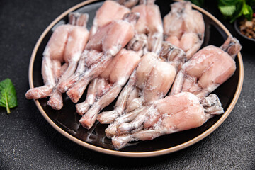 frozen frog legs frozen food healthy meal food snack on the table copy space food background rustic top view