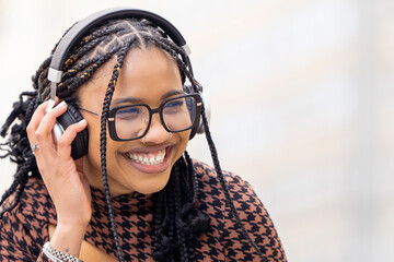 Close up of woman listening to music with headphones