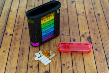 Weekly pills box for daily medication. Health care and pharmacy concept. High quality photo, german