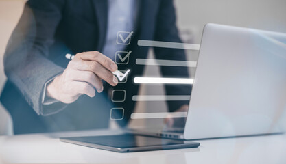Businessman tick sign mark for assessment. Questionnaire, quality evaluation concept. Online survey