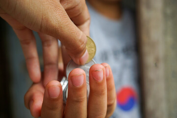 Stock photo of someone who is making a monetary donation