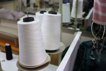 White sewing threads at the tailor.