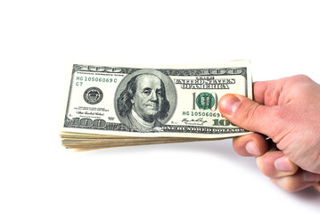 isolated hand with pack of one hundred dollars
