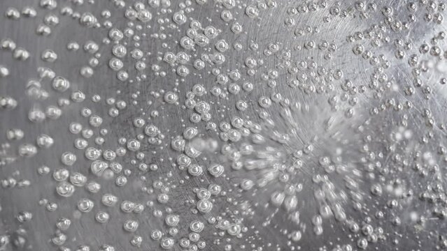 boiling water in a pot with bubbles