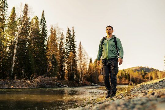 One hiker men walking in the wild