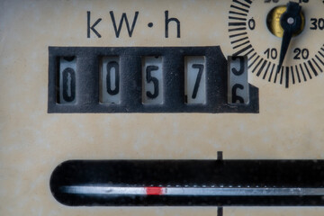 Old analogue electric meter in private household, closeup
