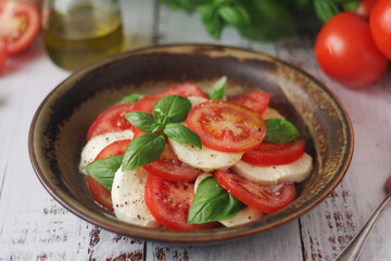 A bowl with traditional Italian caprese salad