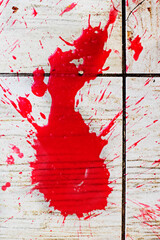 abstract scarlet spot on textured surface. Under the gun of a terrorist attack.act of