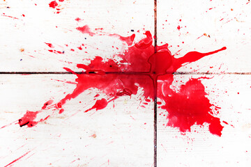 huge abstract scarlet spot on a textured surface. Under the gun of a terrorist attack
