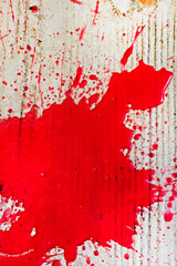 abstract bloody scarlet stain on textured surface. Under the gun of a terrorist attack