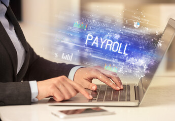 Closeup of businessman hands working on laptop