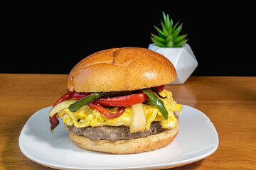 breakfast sandwich  with scramble eggs  , sausage and peppers