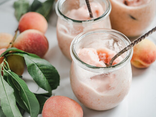Homemade ice cream and ripe, juicy peaches. Close-up, view from above. Tasty and healthy eating concept