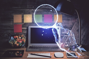 Desktop computer background in office and start up theme hologram drawing. Double exposure. Startup concept.