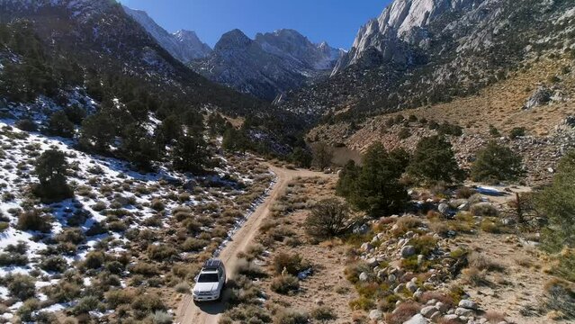 Aerial video of car driving off road in eastern Sierras, Tuttle Creek, California,  near Mount Whitney. Reversing Shot