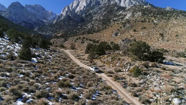 Aerial video of car driving off road in eastern Sierras, Tuttle Creek, California,  near Mount Whitney.