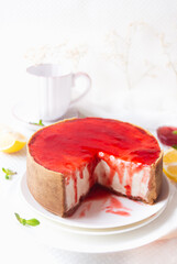 Cheesecake with Strawberry sauce, white plate