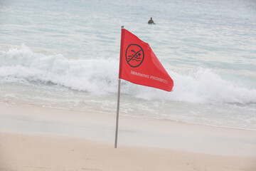 Red flag beach warning, bathing is completely forbidden