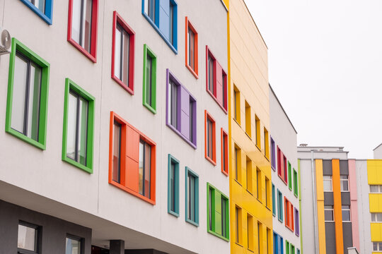 The facade of the building is decorated with different colors of windows.
